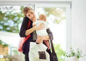 busy working mother with her baby in hand